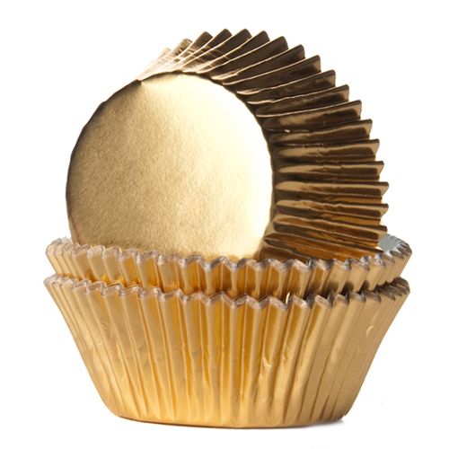 Närbild på muffinsform Guld folierad med skimrande glans