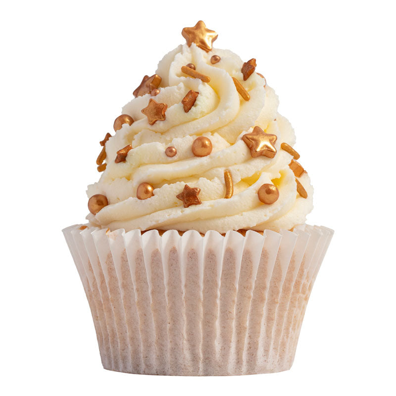 Cupcake dekorerad med skimrande guldströssel i form av stjärnor och pärlor.