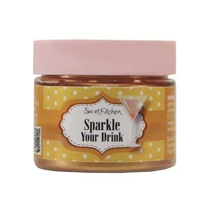 Burk med Sweet Kitchen Sparkle Your Drink i guld, med rosa lock och prickigt etikettmotiv.
