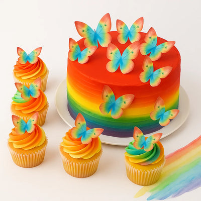 Regnbågstårta dekorerad med ätbara fjärilar i regnbågsfärger från Wilton.