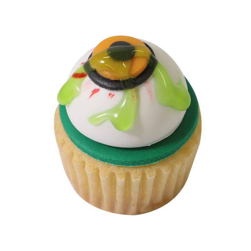 Cupcake I halloweentema dekorerad med ett öga och grönt ätbart slime