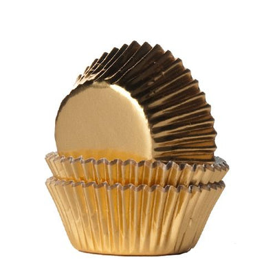 Små guldiga muffinsformar för mini-muffins