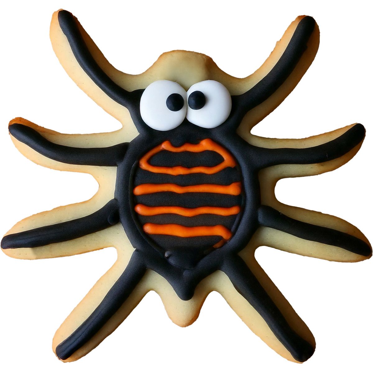 Kaka i form av spindel dekorerad med svart och orange glasyr samt ögon i sugarpaste.