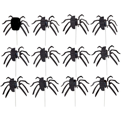 Dekorationer till muffins, i form av svarta spindlar