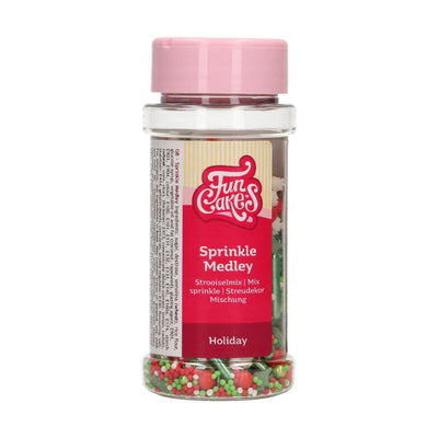 Burk med FunCakes Holiday Sprinkle Medley fylld av juligt strössel i flera färger och former.