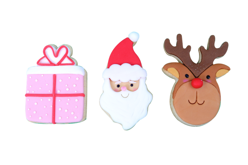 Dekorerade julkakor formade som paket, tomte och ren mot vit bakgrund