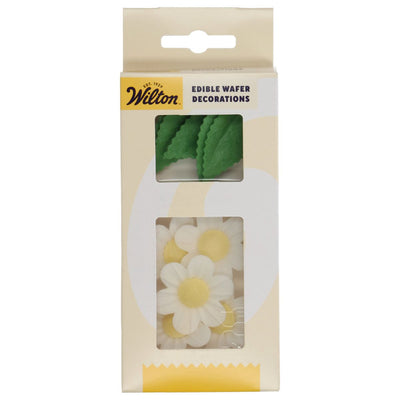 Förpackning med Wilton ätbara waferblommor och gröna blad i vit och gul design