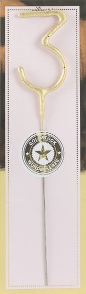 Sifferbloss i form av guldigt nummer 3 mot ljus bakgrund