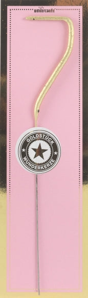 Sifferbloss i form av guldigt nummer 7 mot rosa bakgrund