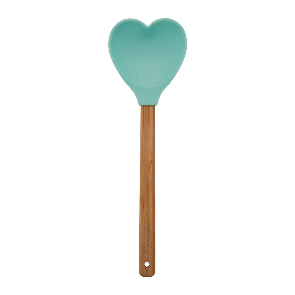 Mintgrön hjärtformad slickepott i silikon med handtag i trä.